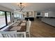 Bright living space with modern light fixture, an open floorplan, and tile flooring at 6429 E Jean Dr, Scottsdale, AZ 85254