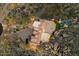 Stunning aerial view of an estate showcasing a tile roof, sprawling layout, lush landscaping, and resort-style pool at 10471 E White Feather Ln, Scottsdale, AZ 85262