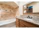 Traditional bathroom with tile shower and granite counters at 10471 E White Feather Ln, Scottsdale, AZ 85262