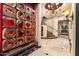 Inviting foyer featuring travertine floors, custom wood art and views to the staircase and hallways at 10471 E White Feather Ln, Scottsdale, AZ 85262