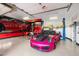 Spacious garage with car lift, motorcycle, and stylish car collection at 10471 E White Feather Ln, Scottsdale, AZ 85262