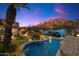 Backyard oasis featuring a lagoon-style pool and desert landscaping at 10471 E White Feather Ln, Scottsdale, AZ 85262