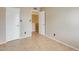 Bedroom featuring tile floors and neutral walls, with two doors leading to additional rooms at 1051 S Dobson Rd # 117, Mesa, AZ 85202