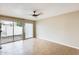 Bright bedroom with sliding glass doors, neutral walls, and sleek tile flooring for easy maintenance at 1051 S Dobson Rd # 117, Mesa, AZ 85202