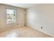 Bright bedroom with tile flooring, a window, and neutral wall color, ready for personal touches at 1051 S Dobson Rd # 117, Mesa, AZ 85202