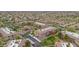 This aerial view highlights the community layout, covered parking, and manicured grounds at 14950 W Mountain View Blvd # 3105, Surprise, AZ 85374