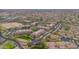 Extensive aerial shot shows the community's layout, green spaces, and parking areas at 14950 W Mountain View Blvd # 3105, Surprise, AZ 85374