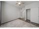 Bedroom featuring closet, ceiling fan, and decorative rug on wood floors at 14950 W Mountain View Blvd # 3105, Surprise, AZ 85374