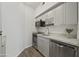 Kitchen area with white cabinets, stainless steel appliances, and tile backsplash at 14950 W Mountain View Blvd # 3105, Surprise, AZ 85374