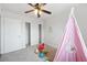 Bright bedroom featuring neutral walls, ceiling fan, and closet at 1531 W Colter St # 7, Phoenix, AZ 85015