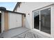 Cozy back patio with gray flooring, storage closet, sliding glass doors, and stylish rug at 1531 W Colter St # 7, Phoenix, AZ 85015