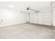 Spacious garage with a sealed concrete floor, and a new door at 16076 W El Cortez Pl, Surprise, AZ 85387