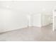 Spacious living room with bright white walls and tile flooring, modern style at 16076 W El Cortez Pl, Surprise, AZ 85387