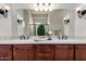 Bathroom featuring double sink, under-sink cabinet, and a big mirror at 1631 N Lynch --, Mesa, AZ 85207