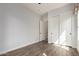 Bedroom featuring wood floors, a double closet, and windows at 1631 N Lynch --, Mesa, AZ 85207