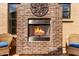 Outdoor brick fireplace with a metal screen and a decorative wrought-iron piece exudes warmth and style at 1631 N Lynch --, Mesa, AZ 85207