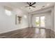 Elegant living room featuring wood floors and french doors overlooking the backyard at 1631 N Lynch --, Mesa, AZ 85207