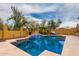 Beautiful in-ground pool with a waterfall feature surrounded by a well-kept landscape at 1631 N Lynch --, Mesa, AZ 85207