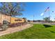 Inviting community entrance with manicured landscaping and American flags at 1631 N Lynch --, Mesa, AZ 85207