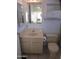 A bathroom with a vanity, toilet, mirror and built in storage space at 1720 E Augusta Ave, Chandler, AZ 85249