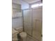 A bathroom with a shower and toilet with some built in storage space at 1720 E Augusta Ave, Chandler, AZ 85249