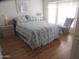 Bright bedroom with a large bed, rocking chair, and two night stands at 1720 E Augusta Ave, Chandler, AZ 85249