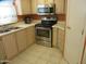 Well-lit kitchen featuring stainless steel appliances and neutral countertops at 1720 E Augusta Ave, Chandler, AZ 85249