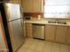 Galley kitchen featuring stainless steel appliances and ample counter space at 1720 E Augusta Ave, Chandler, AZ 85249