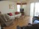 Relaxing living room with comfortable seating, bright windows, and a wooden coffee table at 1720 E Augusta Ave, Chandler, AZ 85249