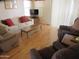 Relaxing living room with comfortable seating, bright windows, and a wooden coffee table at 1720 E Augusta Ave, Chandler, AZ 85249