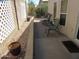 A shaded patio with a lattice fence and some outdoor furniture at 1720 E Augusta Ave, Chandler, AZ 85249