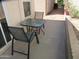 A covered patio with some outdoor furniture and a view of some plants at 1720 E Augusta Ave, Chandler, AZ 85249