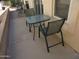 A covered patio with some outdoor furniture and a view of some plants at 1720 E Augusta Ave, Chandler, AZ 85249