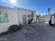 Desert landscaped backyard with fountain and covered patio, perfect for enjoying the Arizona climate at 19045 N 45Th Ave, Glendale, AZ 85308