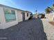 Desert landscaped backyard with covered patio, perfect for relaxing and enjoying the outdoors at 19045 N 45Th Ave, Glendale, AZ 85308