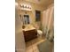 Bathroom featuring vanity with wood cabinet, toilet, shower with curtain, and tile floor at 19045 N 45Th Ave, Glendale, AZ 85308