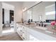 Modern bathroom with double sinks, sleek fixtures, and a black-framed mirror at 1920 E Creek Canyon Rd, Phoenix, AZ 85086