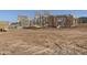 A home in the early stages of construction showcases its sturdy wood frame and promising design under a bright blue sky at 1920 E Creek Canyon Rd, Phoenix, AZ 85086