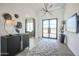 Bright entryway with decorative wall art, modern light fixture, and steel frame glass door at 1920 E Creek Canyon Rd, Phoenix, AZ 85086