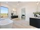 Luxurious bathroom with dual vanities, a soaking tub, and scenic views at 1940 E Creek Canyon Rd, Phoenix, AZ 85086