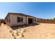 View of backyard featuring an uncovered patio and block fence surround at 23769 N 163Rd Dr, Surprise, AZ 85387
