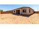 View of backyard featuring an uncovered patio and block fence surround at 23769 N 163Rd Dr, Surprise, AZ 85387