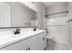 Well-lit bathroom featuring double sinks, a large mirror and a shower-tub combo at 23769 N 163Rd Dr, Surprise, AZ 85387