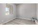Bedroom featuring light wood floors, neutral walls and window at 23769 N 163Rd Dr, Surprise, AZ 85387