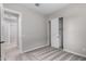 Bedroom view showing light gray walls, carpet and a closet with sliding doors at 23769 N 163Rd Dr, Surprise, AZ 85387