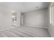 Spacious bedroom with neutral walls, carpet, and walk-in bathroom at 23769 N 163Rd Dr, Surprise, AZ 85387