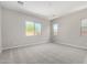 Spacious bedroom with neutral walls, carpet, and windows providing ample natural light at 23769 N 163Rd Dr, Surprise, AZ 85387