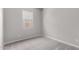 Bright bedroom showcasing a plush carpet, a neutral palette and a window at 23769 N 163Rd Dr, Surprise, AZ 85387