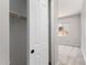 Interior shot of closet with a door and shelving in a neutrally decorated room at 23769 N 163Rd Dr, Surprise, AZ 85387