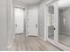 Entryway featuring light wood floors, neutral walls and white doors at 23769 N 163Rd Dr, Surprise, AZ 85387